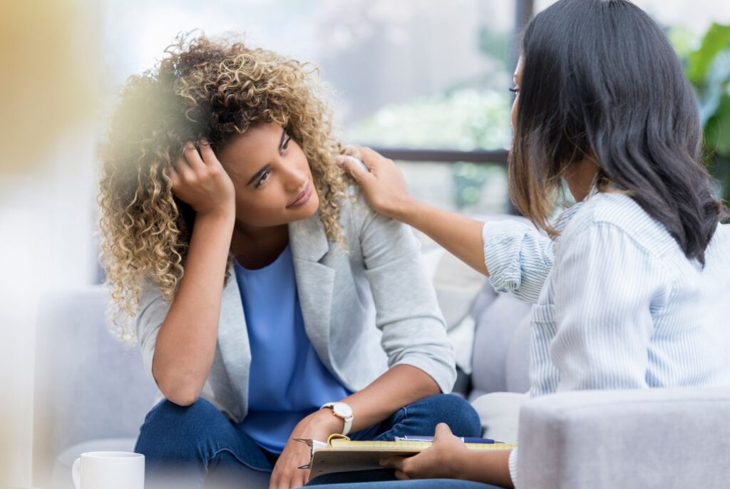Two women in a serious conversation